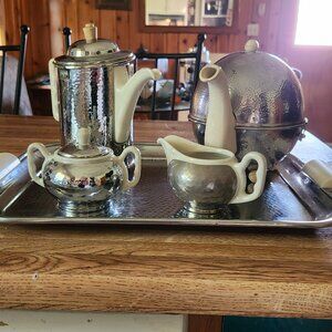 Vintage coffee pot, tea pot, sugar and cream dishes with serving tray.